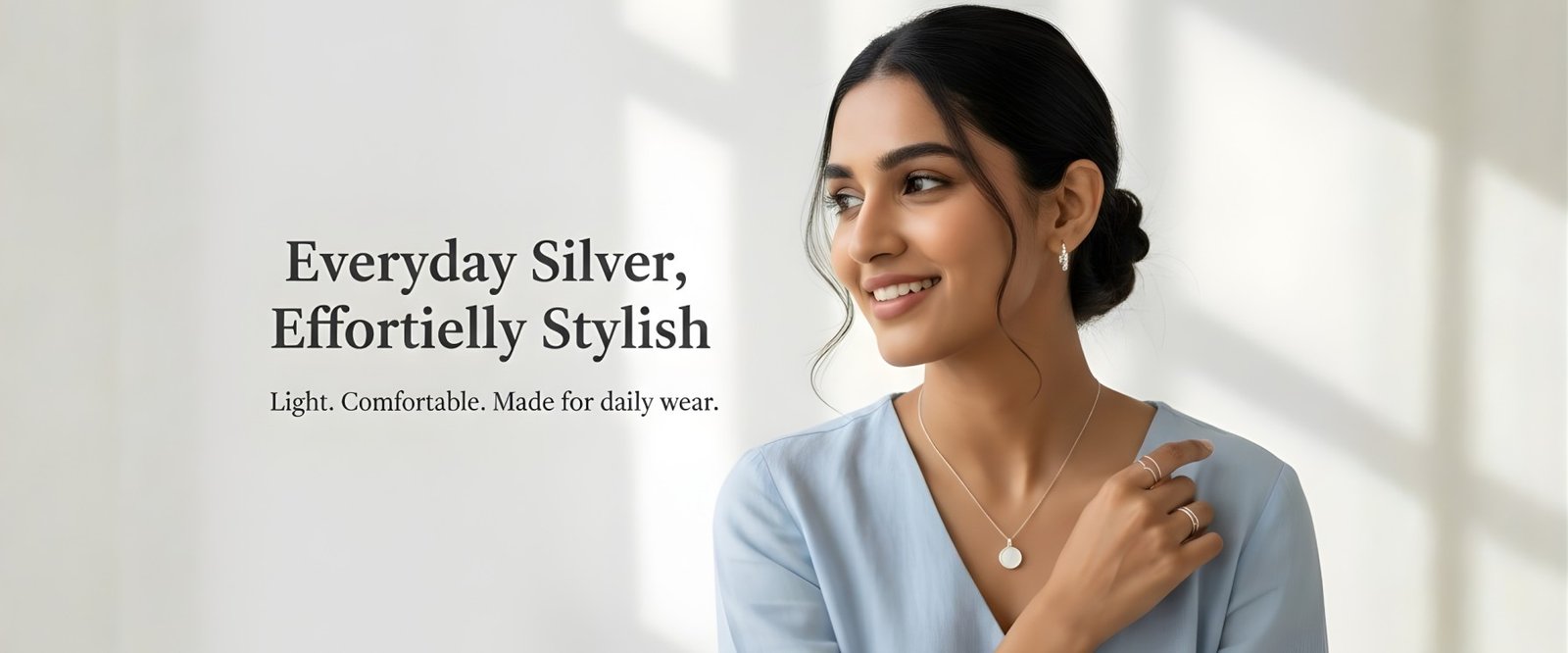 Woman wearing lightweight daily wear silver necklace and rings